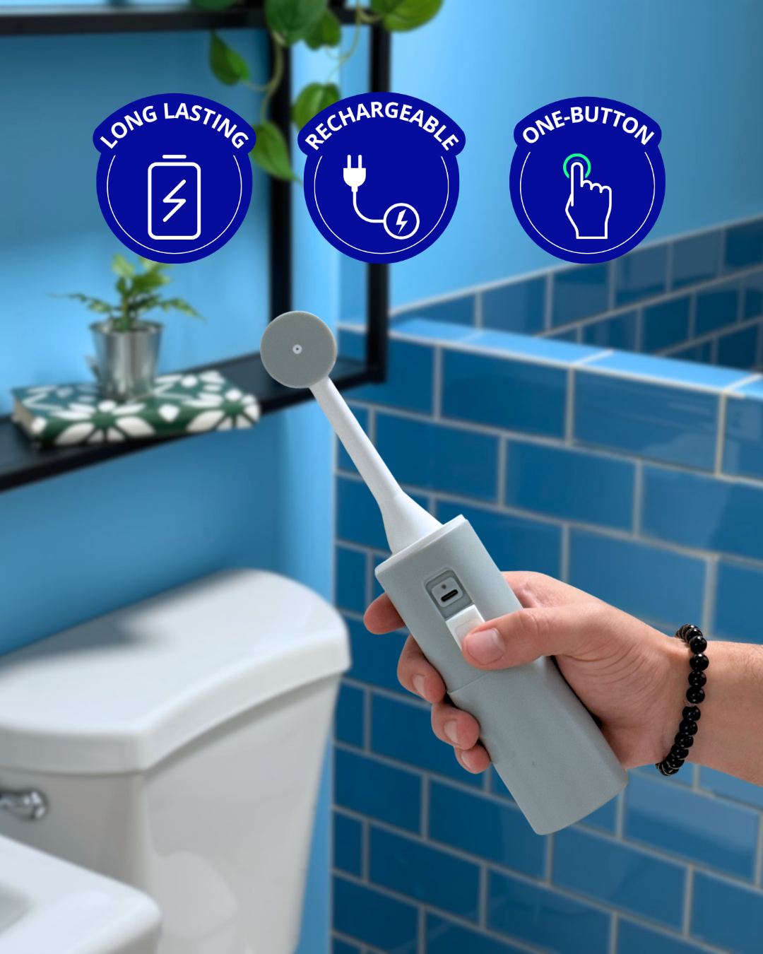 Portable bidet being used in bathroom showing its USBC port